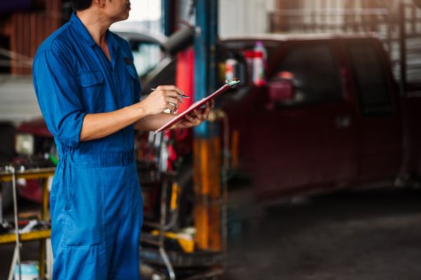 a mechanic ready to inspect a vehicle to prevent breakdowns