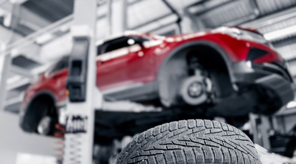 Vehicle wheel service being conducted to help prevent premature tire wear